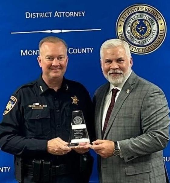 Photo of Sheriff Rand Henderson and District Attorney Brett Ligon with Agency of the Year Award 2023.